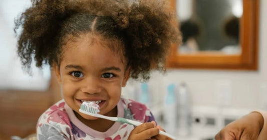 girl brushing teeth