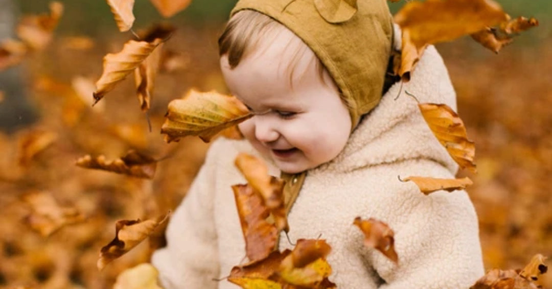 baby in leaves