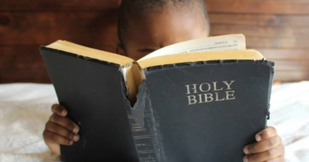 black boy reading bible