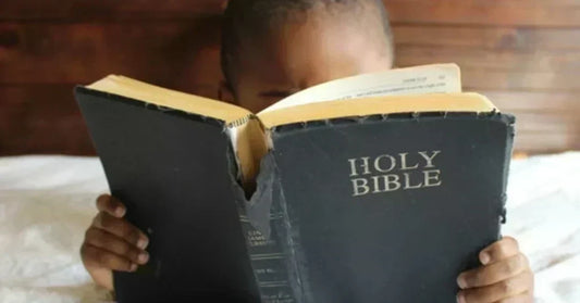 black boy reading bible