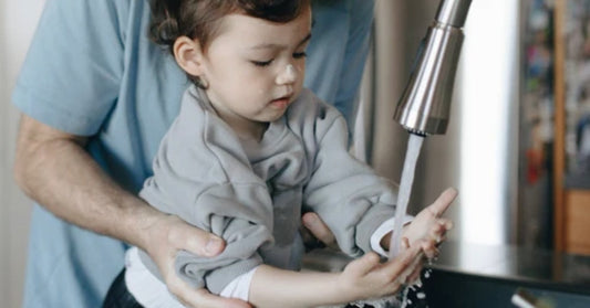 child washing hands