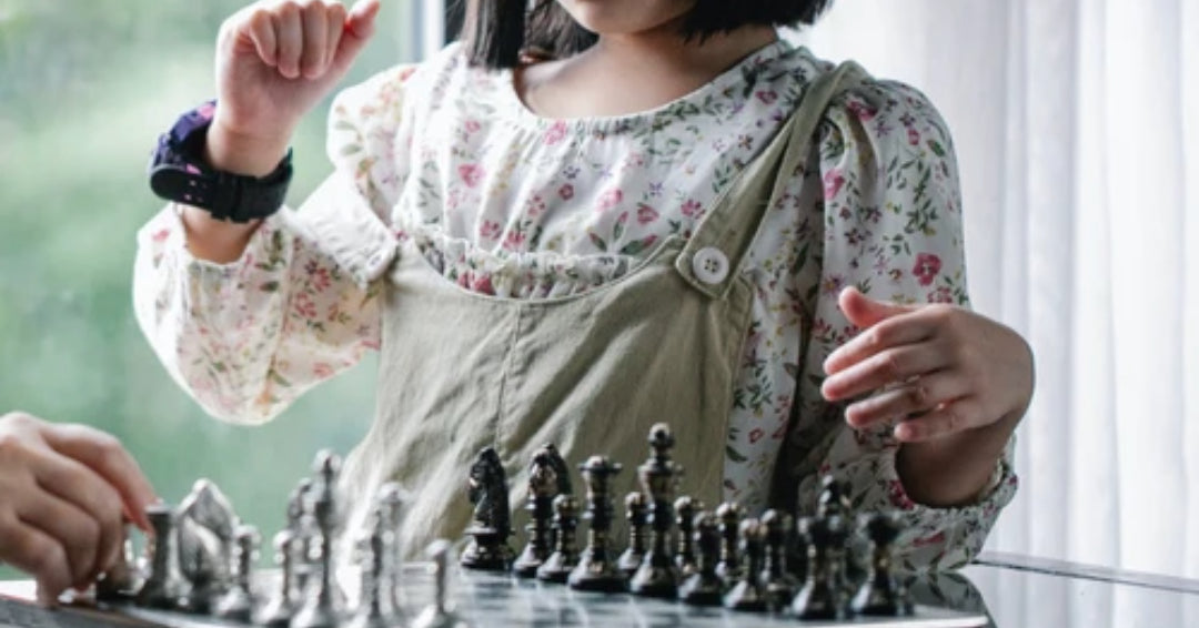 girl playing chess