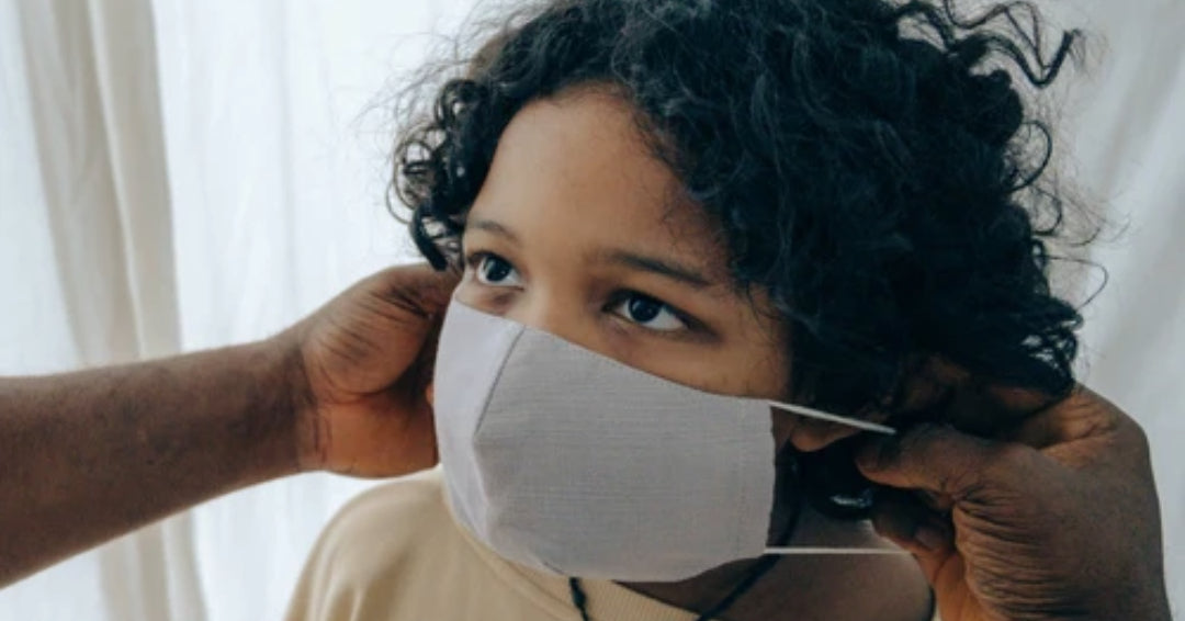 child wearing medical mask