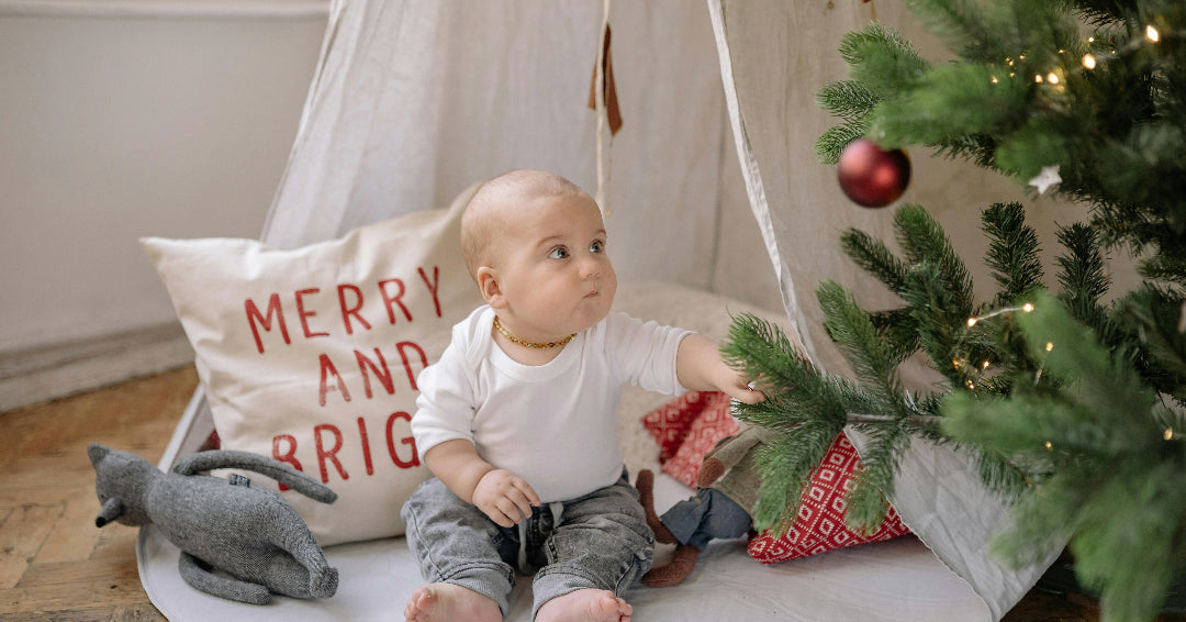 toddler under christmas tree