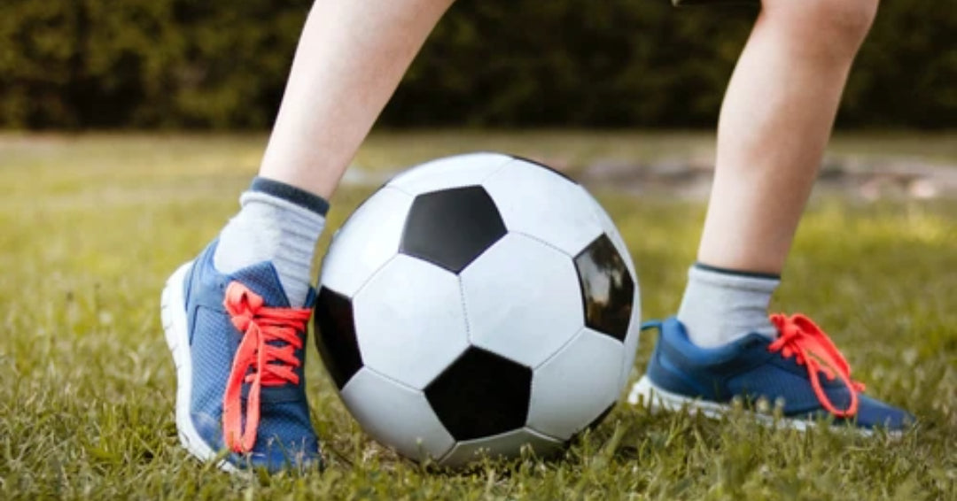 child playing soccer